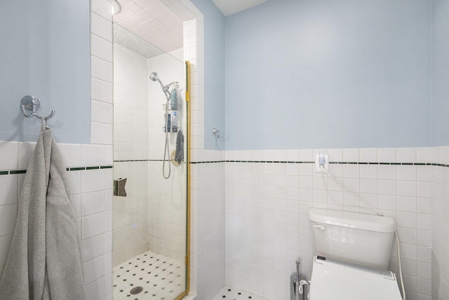 3942 Harmon Dr, Fremont, MI 49412 - bathroom with toilet, a stall shower, wainscoting, and tile walls