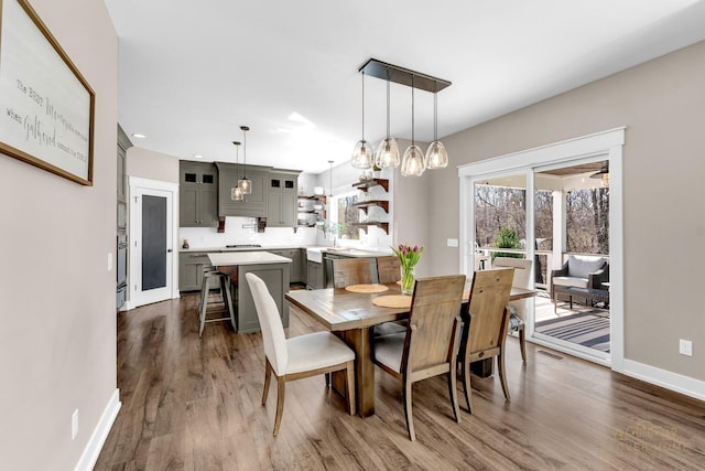 dining area featuring baseboards, recessed lighting, and dark wood-style floors