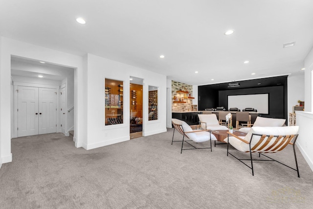 living room with carpet floors, recessed lighting, stairway, baseboards, and indoor bar