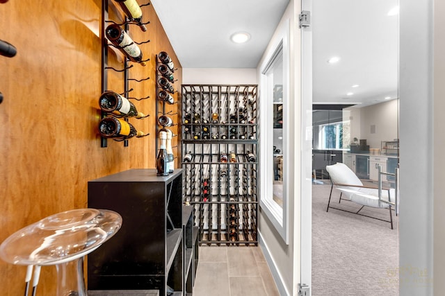 wine area featuring wine cooler, tile patterned floors, and recessed lighting