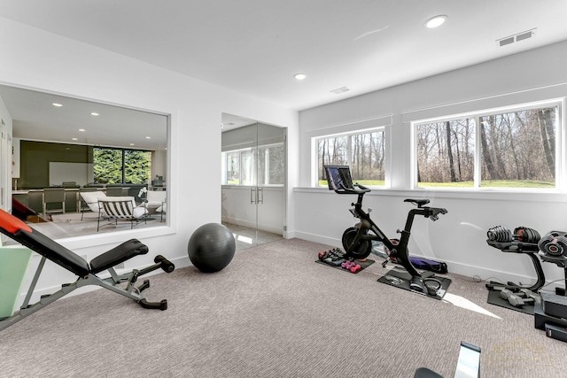 exercise area featuring recessed lighting, carpet, and visible vents