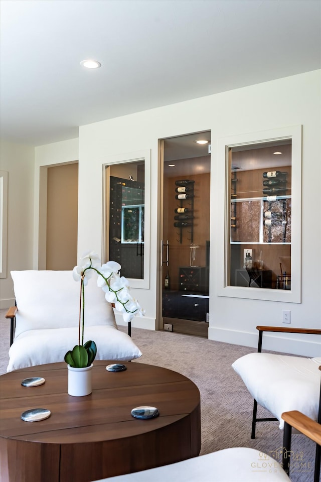 carpeted living room with baseboards and recessed lighting