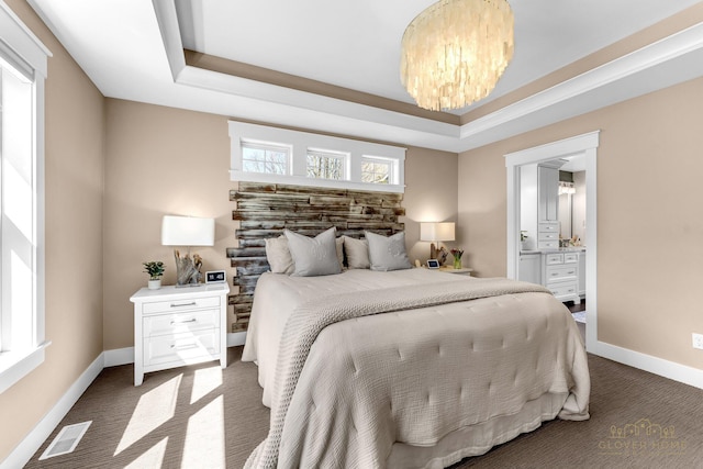 bedroom featuring dark carpet, visible vents, baseboards, and a notable chandelier