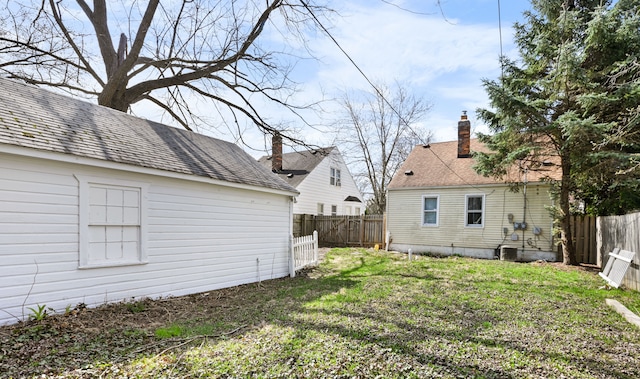 view of yard with a fenced backyard
