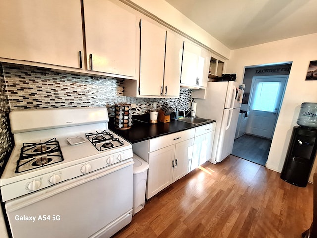 7541 Sloan St, Taylor, MI 48180 - kitchen with white appliances, white cabinetry, a sink, and wood finished floors