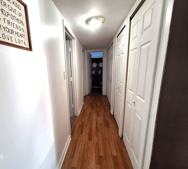 7541 Sloan St, Taylor, MI 48180 - corridor with baseboards and wood finished floors