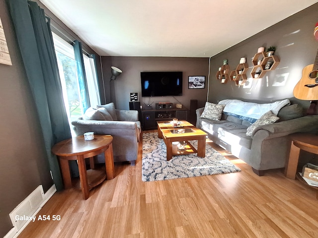 7541 Sloan St, Taylor, MI 48180 - living room with visible vents and light wood finished floors