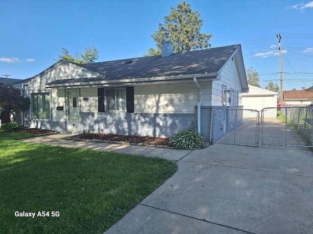 7541 Sloan St, Taylor, MI 48180 - view of front of home with a front lawn, fence, a gate, and a chimney