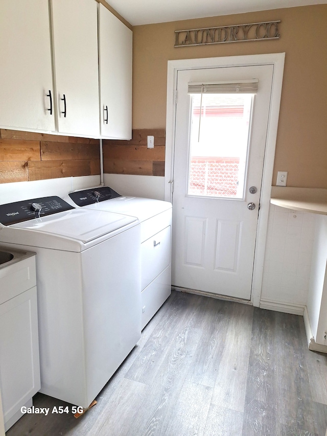 7541 Sloan St, Taylor, MI 48180 - washroom featuring cabinet space, washer and clothes dryer, and light wood finished floors