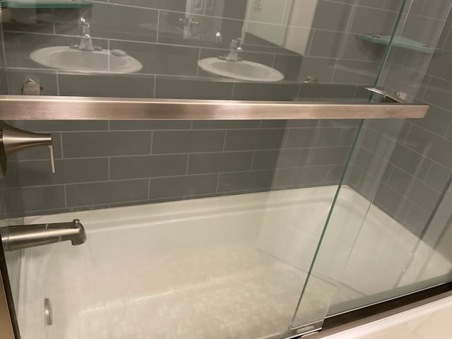 full bath with a shower stall