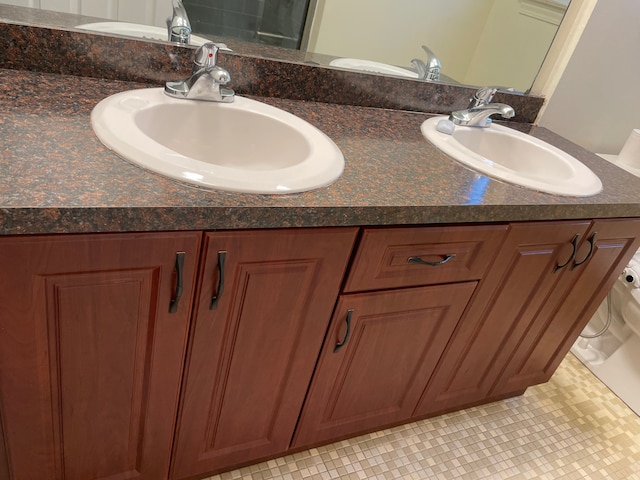 bathroom featuring double vanity and a sink
