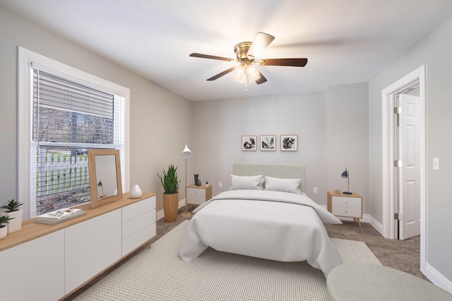 bedroom featuring baseboards, a ceiling fan, and light carpet