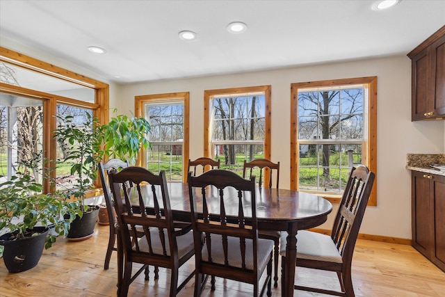 dining area featuring recessed lighting, baseboards, and light wood-style floors