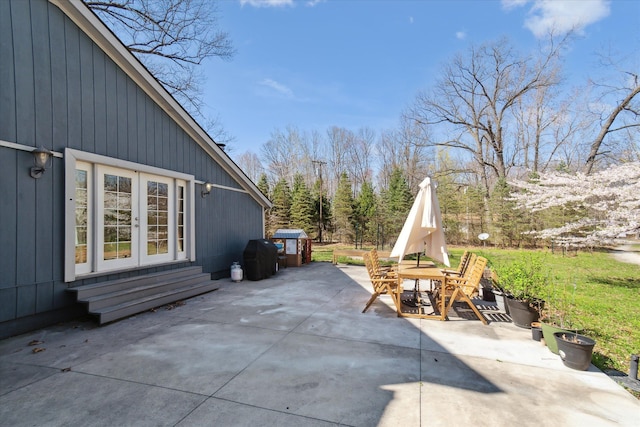 view of patio featuring entry steps and outdoor dining area