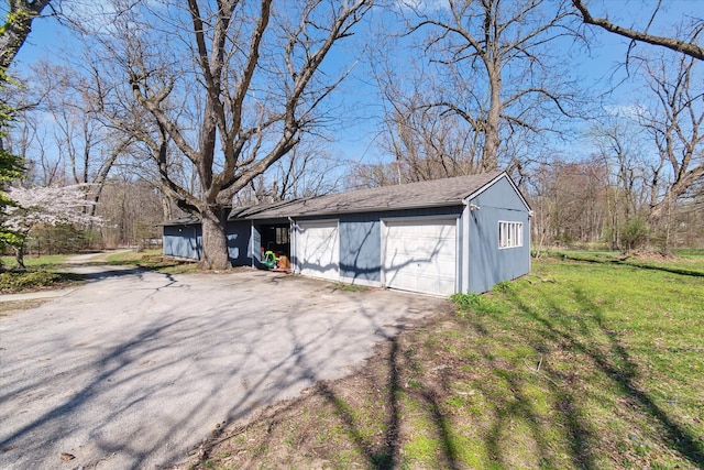 exterior space featuring aphalt driveway and a garage