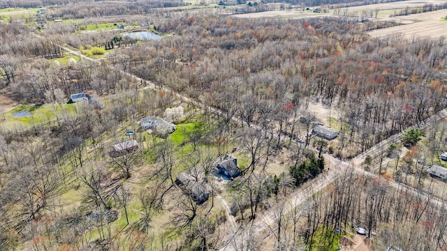 aerial view featuring a rural view and a view of trees