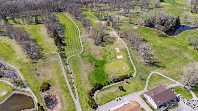 aerial view featuring a water view and view of golf course