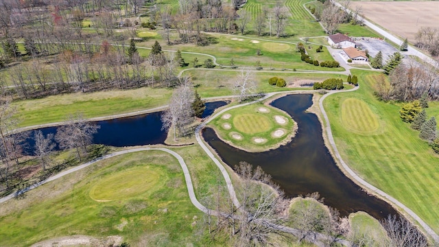 aerial view featuring golf course view and a water view