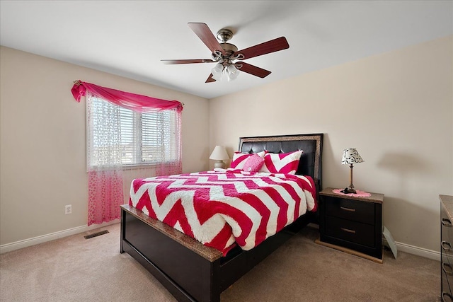 bedroom featuring light carpet, baseboards, and visible vents
