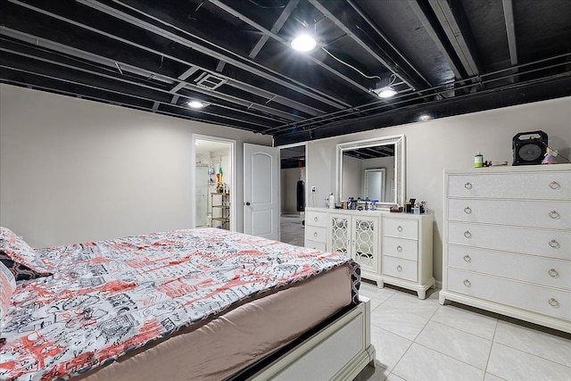 bedroom featuring light tile patterned floors