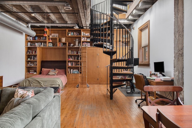 3139 Woodward Ave Unit 6, Detroit, MI 48201 - bedroom with wood-type flooring and a desk
