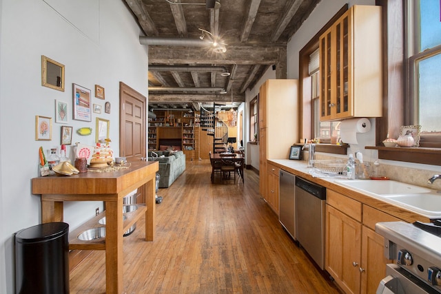 3139 Woodward Ave Unit 6, Detroit, MI 48201 - kitchen featuring dishwasher, light wood finished floors, light countertops, glass insert cabinets, and beam ceiling