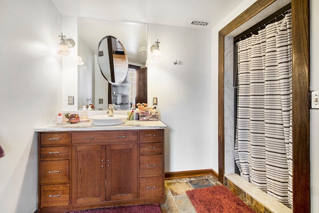 3139 Woodward Ave Unit 6, Detroit, MI 48201 - bathroom with vanity, stone tile floors, and curtained shower