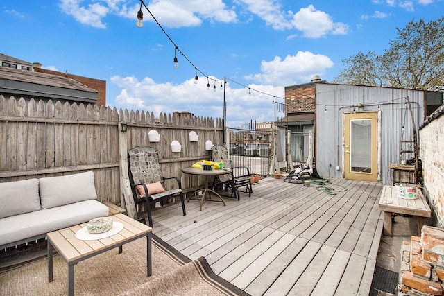 3139 Woodward Ave Unit 6, Detroit, MI 48201 - deck with outdoor lounge area and a fenced backyard