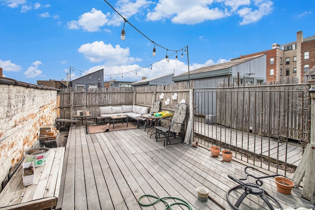 3139 Woodward Ave Unit 6, Detroit, MI 48201 - wooden terrace with outdoor lounge area and a fenced backyard