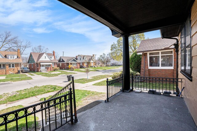 view of patio featuring a residential view and a porch