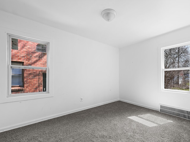 12816 Payton St, Detroit, MI 48224 - carpeted empty room with baseboards and visible vents