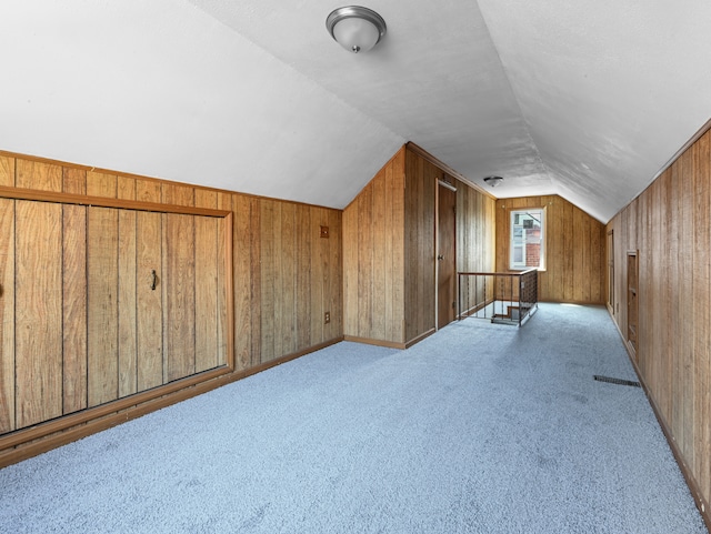 12816 Payton St, Detroit, MI 48224 - bonus room featuring wood walls, vaulted ceiling, and carpet floors