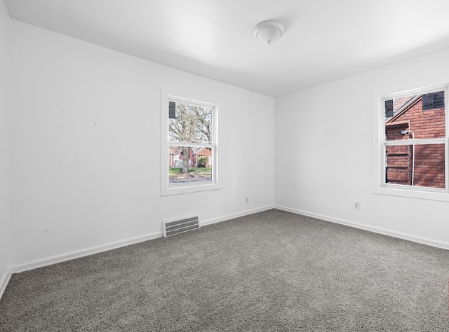 12816 Payton St, Detroit, MI 48224 - unfurnished room with visible vents, baseboards, and carpet floors