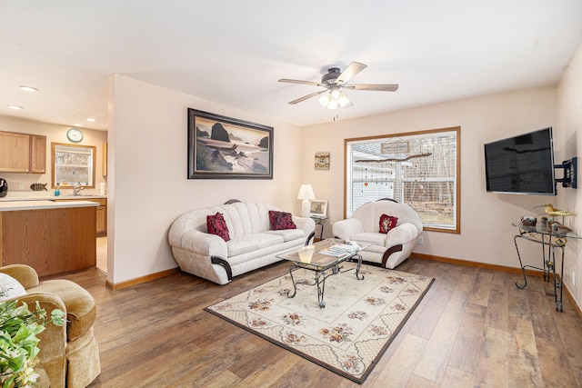 10412 W Woodrow Rd, Shelby, MI 49455 - living area with ceiling fan, light wood finished floors, baseboards, and recessed lighting