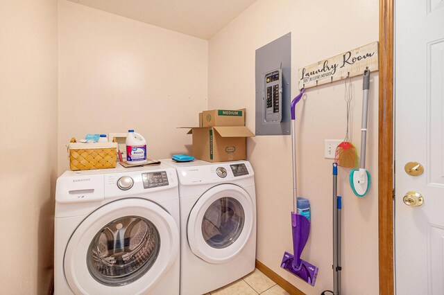 10412 W Woodrow Rd, Shelby, MI 49455 - washroom featuring electric panel, light tile patterned floors, laundry area, and washer and clothes dryer