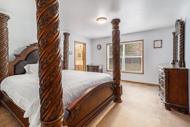 10412 W Woodrow Rd, Shelby, MI 49455 - bedroom with baseboards, connected bathroom, and carpet