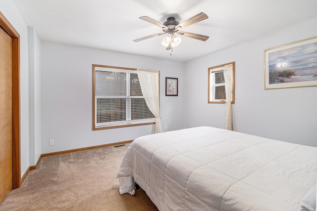 10412 W Woodrow Rd, Shelby, MI 49455 - bedroom with carpet flooring, baseboards, a ceiling fan, and visible vents