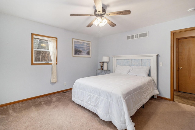 10412 W Woodrow Rd, Shelby, MI 49455 - carpeted bedroom with baseboards, a ceiling fan, and visible vents