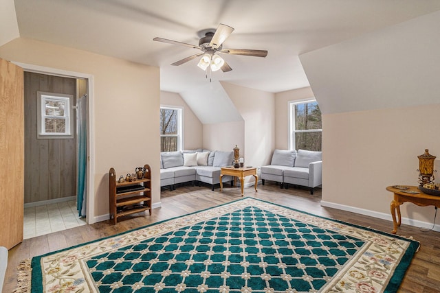 10412 W Woodrow Rd, Shelby, MI 49455 - sitting room with lofted ceiling, ceiling fan, baseboards, and wood finished floors
