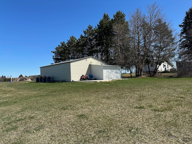 view of yard featuring an outbuilding and an outdoor structure