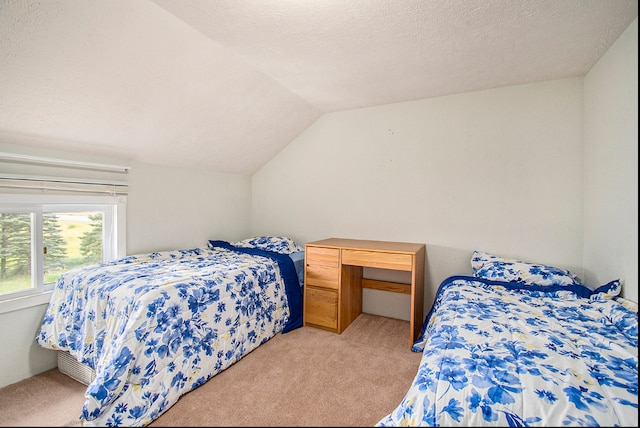 bedroom with light carpet, a textured ceiling, and vaulted ceiling