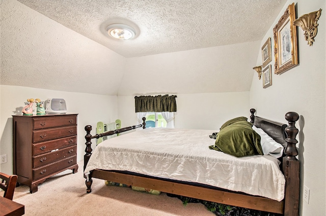 carpeted bedroom featuring a textured ceiling and lofted ceiling