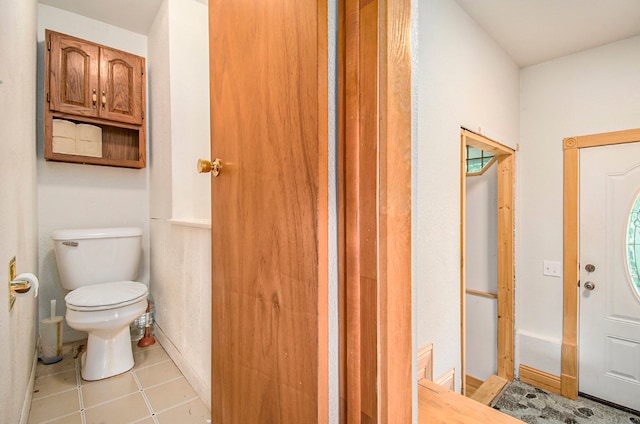 bathroom featuring tile patterned floors and toilet