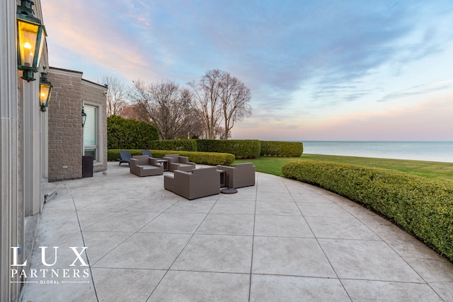view of patio / terrace with an outdoor hangout area and a water view