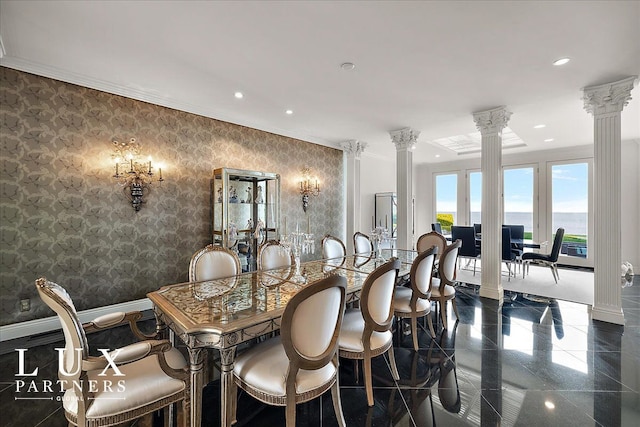 dining space featuring wallpapered walls, recessed lighting, granite finish floor, crown molding, and decorative columns