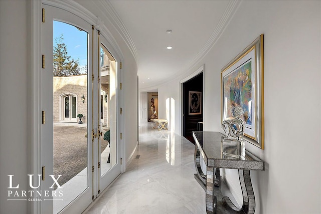 hall featuring marble finish floor, arched walkways, french doors, baseboards, and ornamental molding