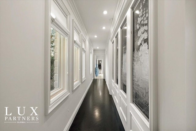 hallway with recessed lighting, dark wood-type flooring, and crown molding