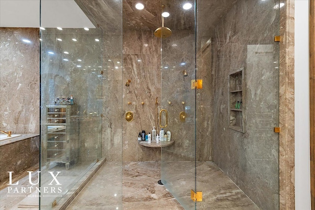 full bathroom with a shower with door and marble finish floor