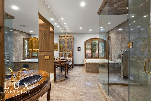 bathroom with visible vents, a sink, recessed lighting, marble finish floor, and a garden tub