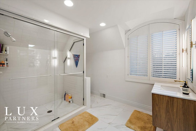 full bathroom with vanity, visible vents, marble finish floor, a stall shower, and baseboards